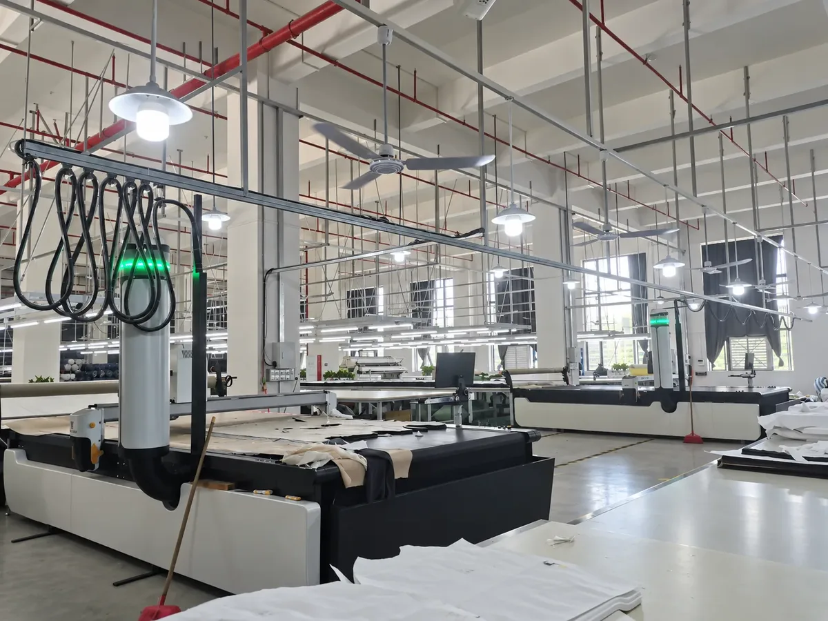 Automated fabric cutting equipment in a garment production room