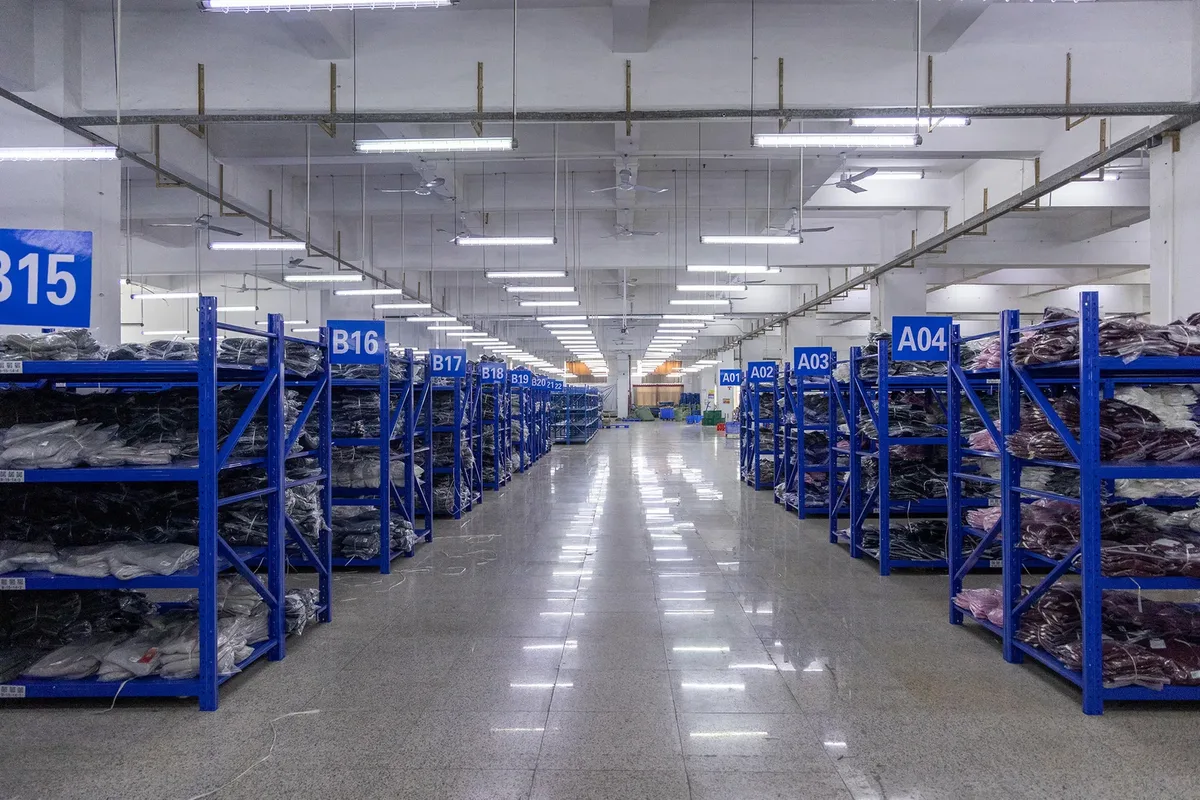 Organized storage racks for garment materials and production staging