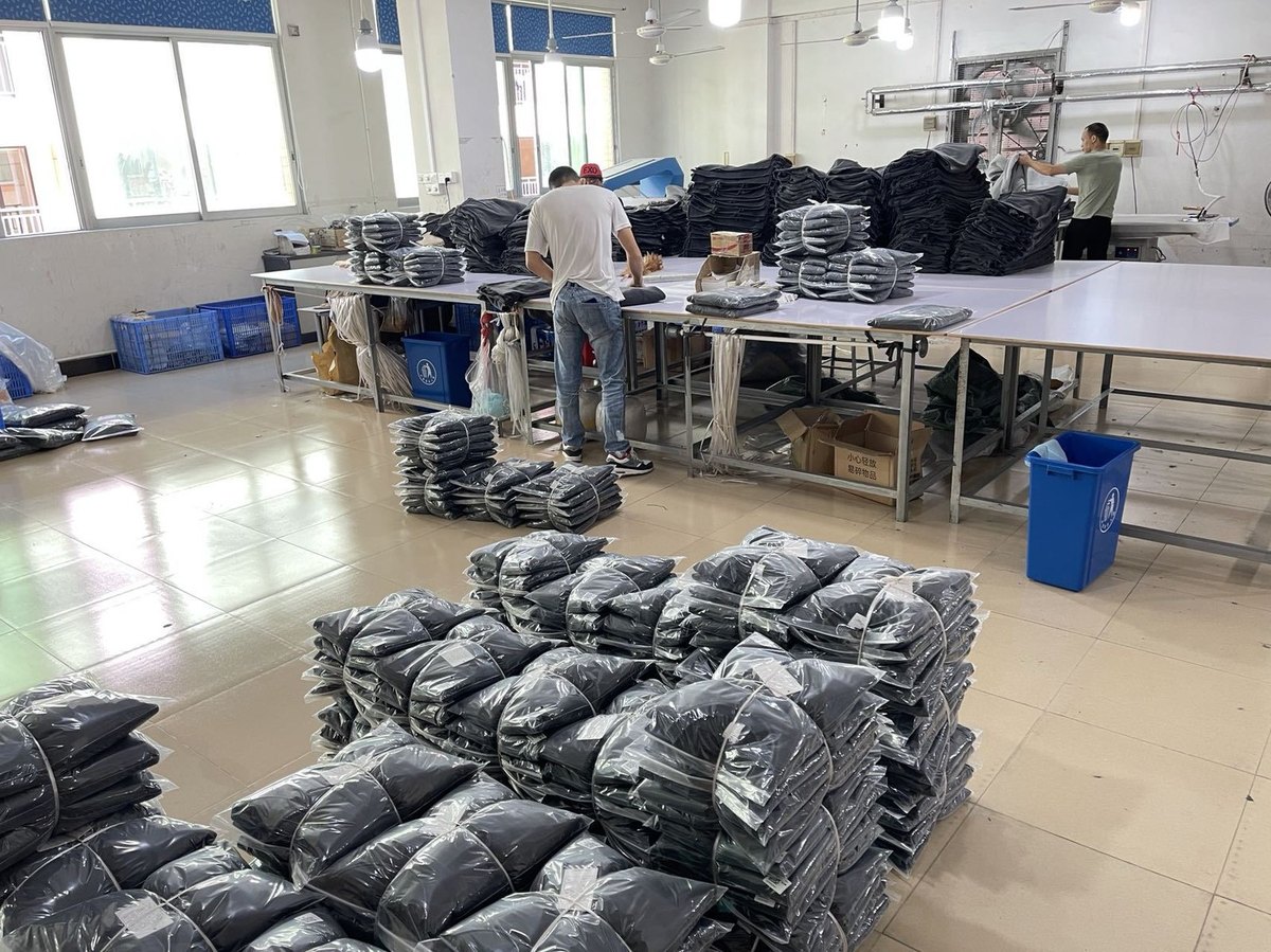Finished garments being folded and packed in a production area