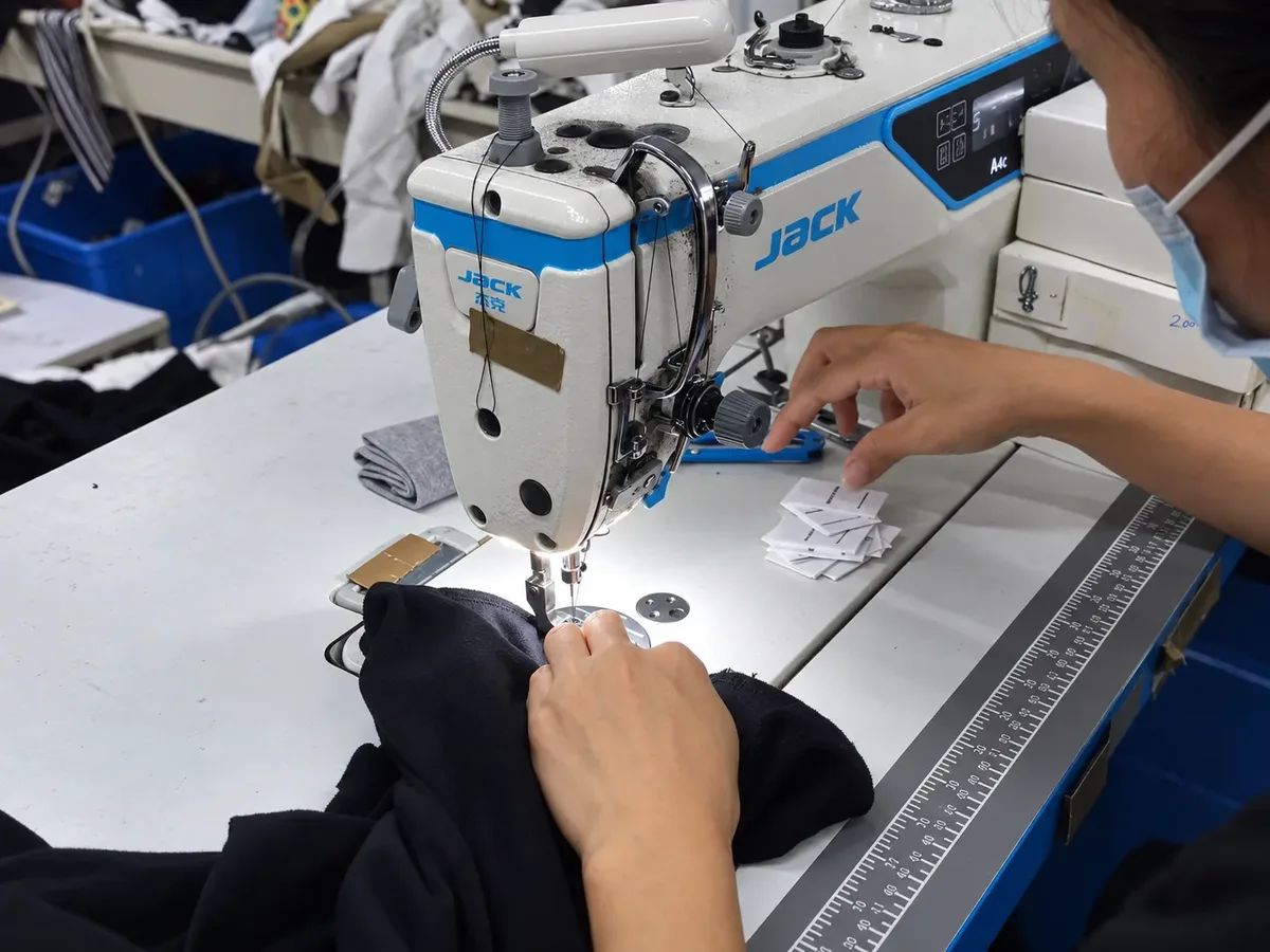 Garment construction at an industrial sewing workstation