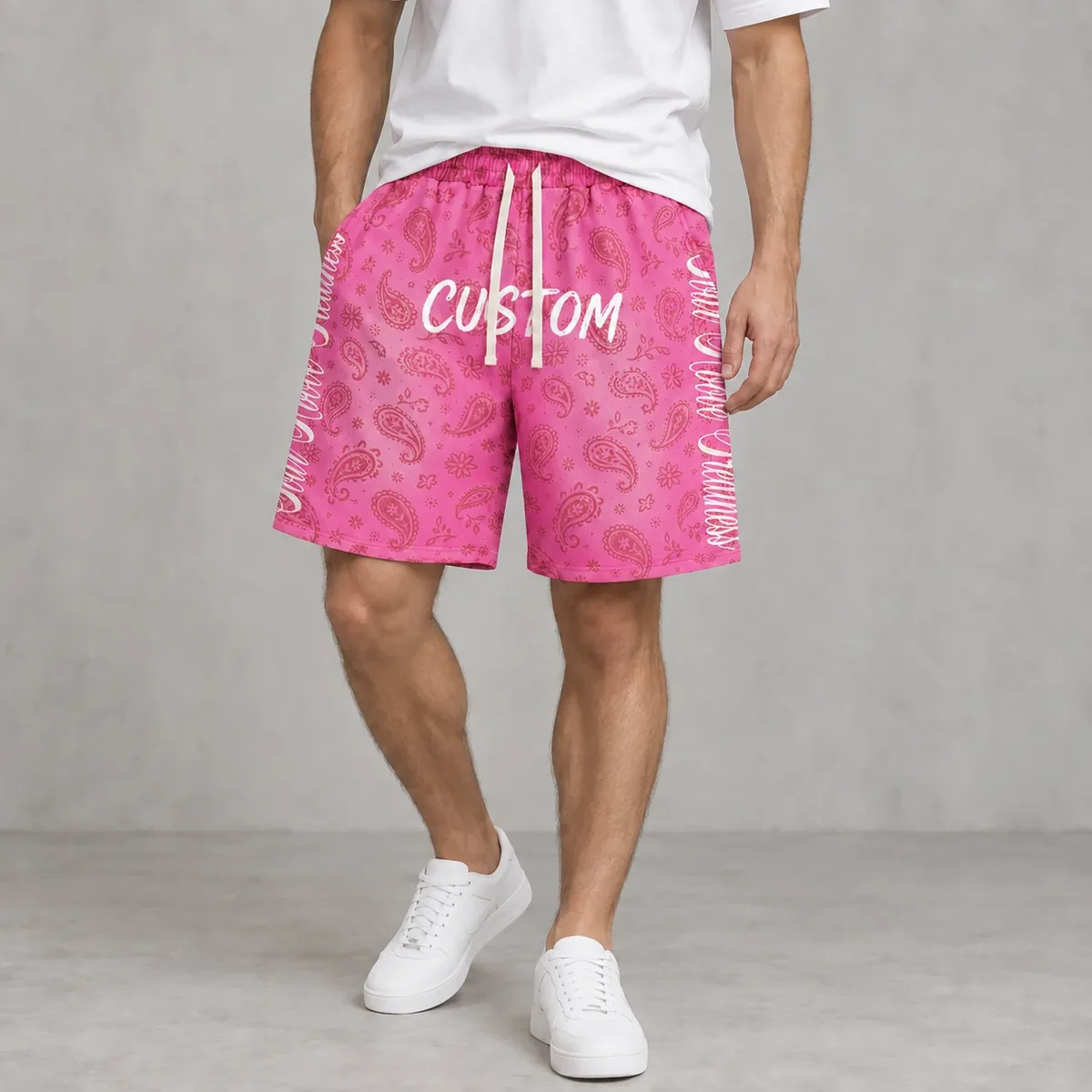 Model wearing allover bandana-print baggy shorts