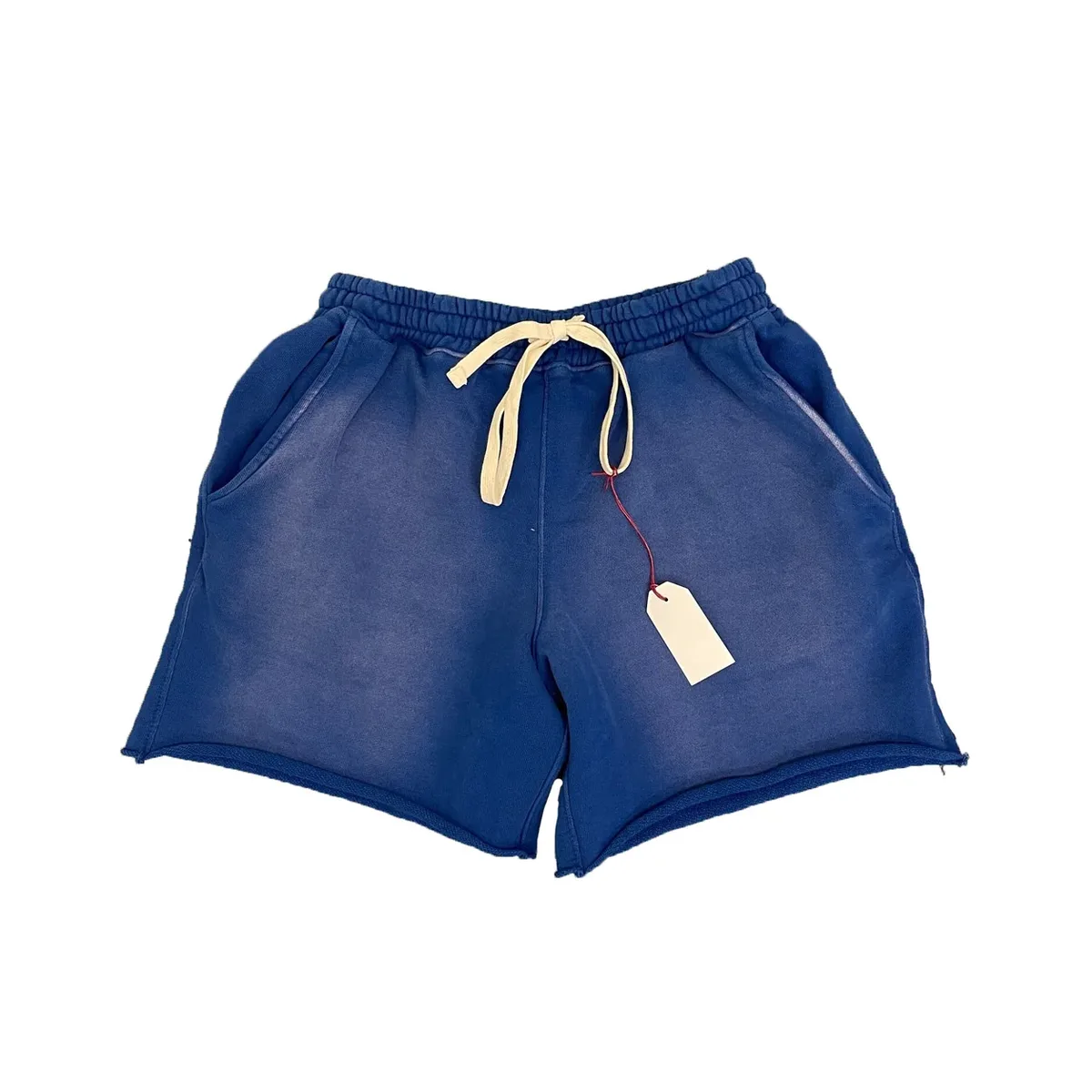 Front view of garment-dyed raw-hem sweat shorts