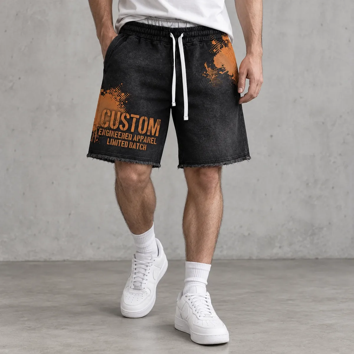 Model wearing splatter-print distressed sweat shorts