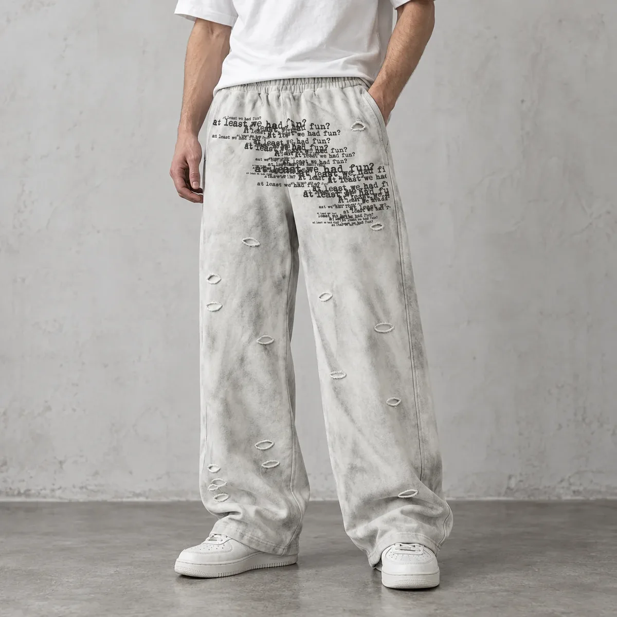 Model wearing cloud-wash ripped wide-leg sweatpants