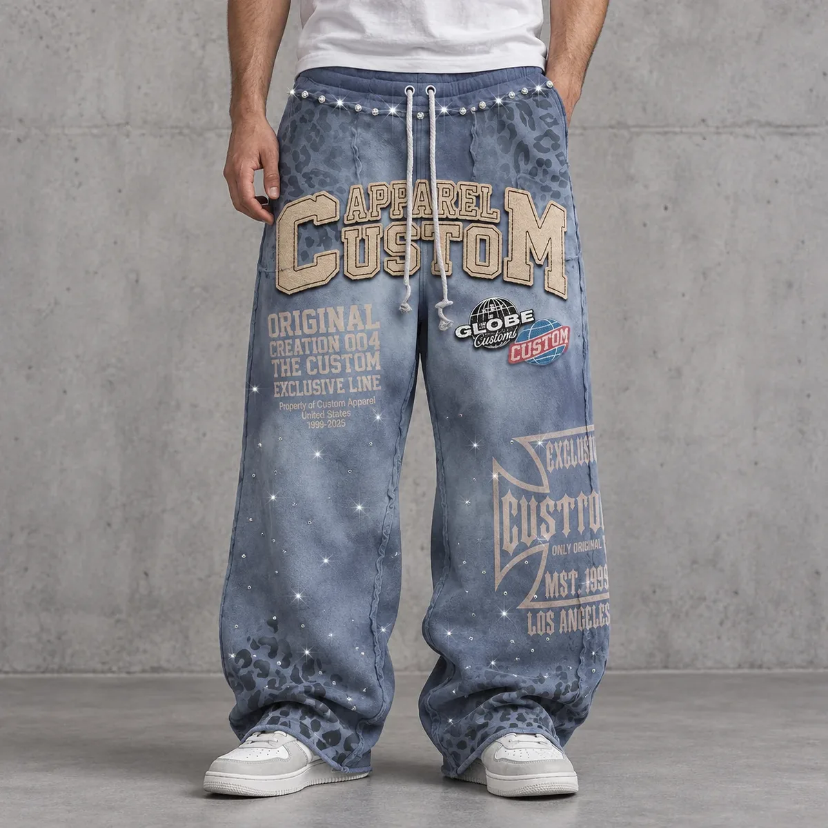 Model wearing rhinestone graphic washed sweatpants