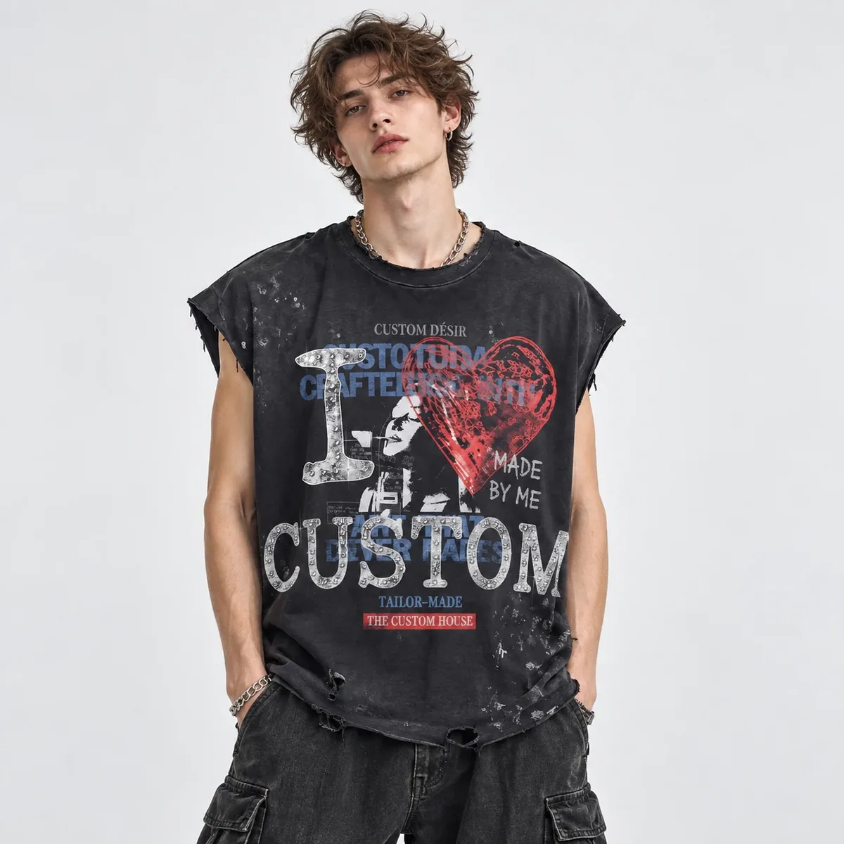 Model wearing distressed sleeveless boxy t-shirt